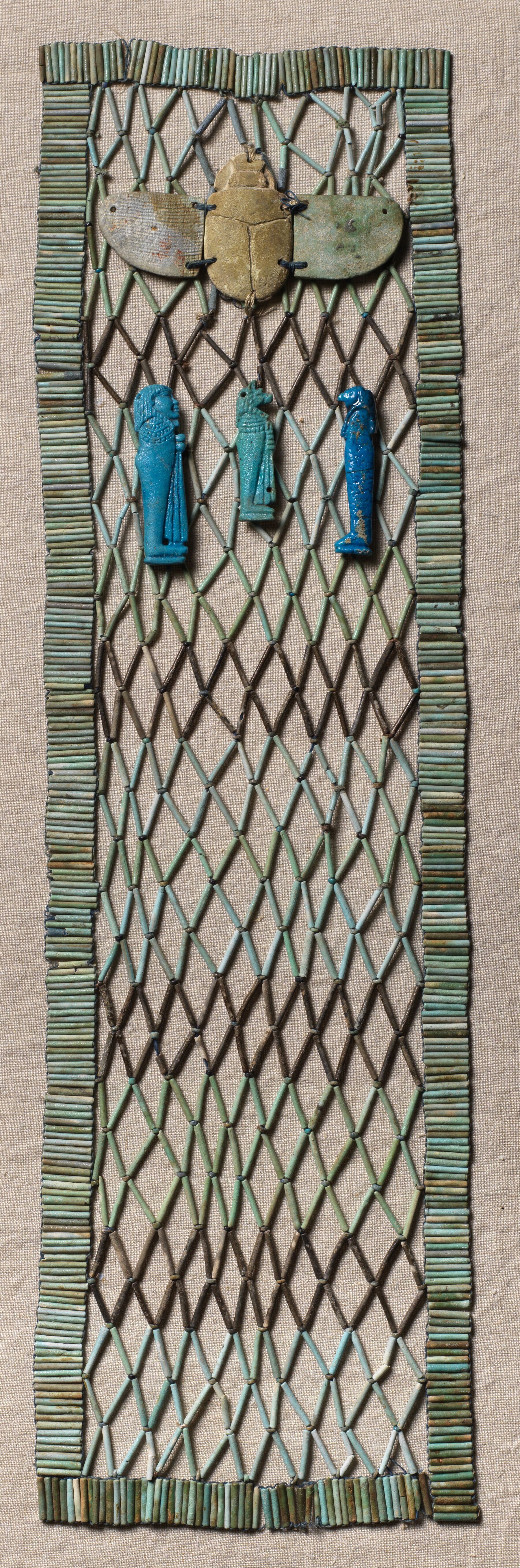 Mummy Bead Net with Winged Scarab, Imsety Amulet, Duamutef Amulet, Qebehsenuef Amulet