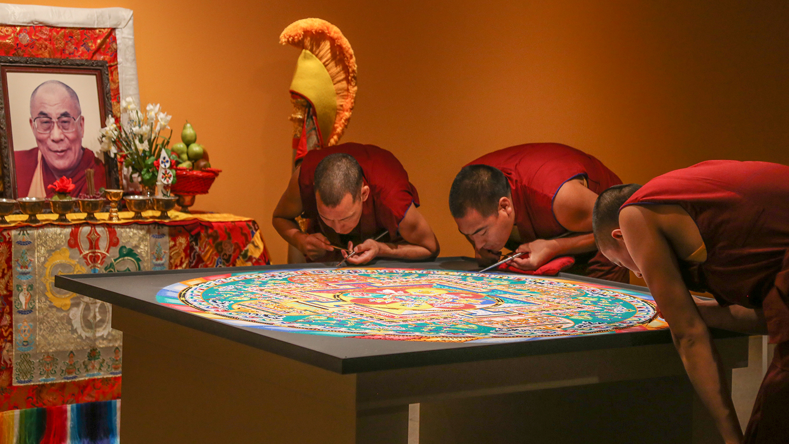 Monks create a sand mandala