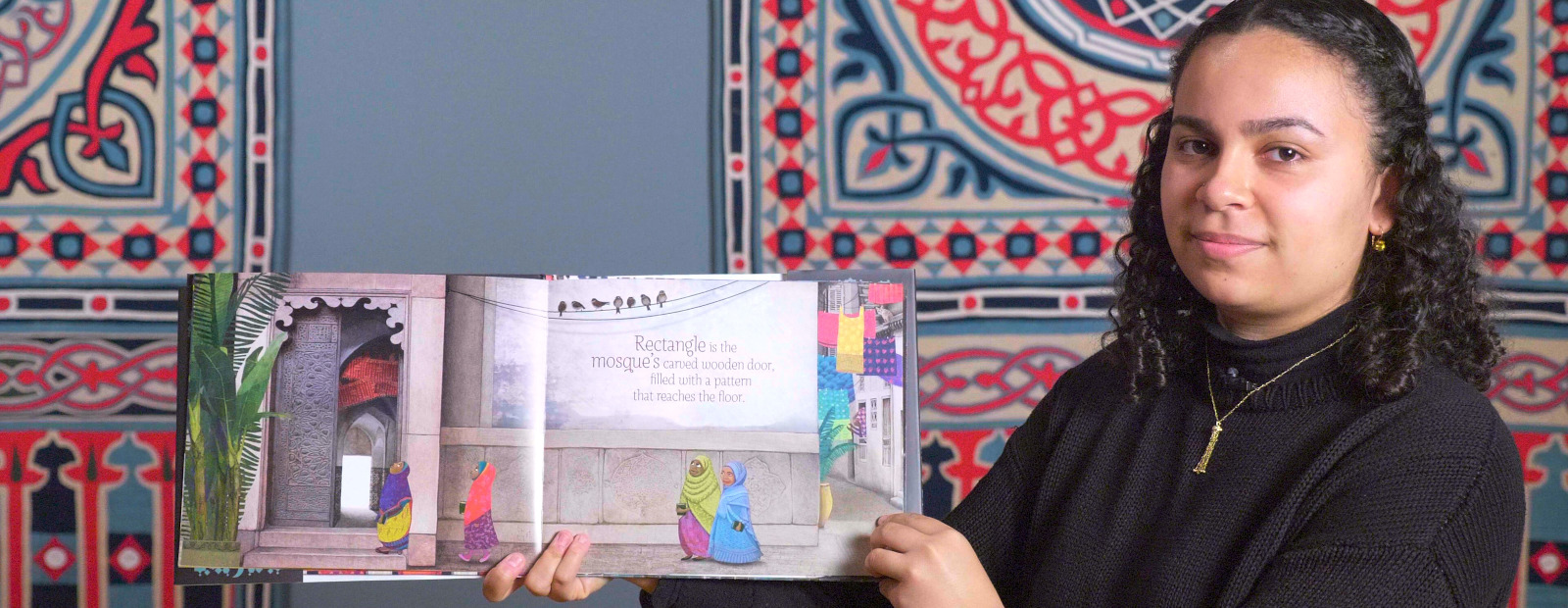 Emory student Sojourner Hunt (C'22) reads Crescent Moons and Pointed Minarets: A Muslim Book of Shapes by Hena Khan