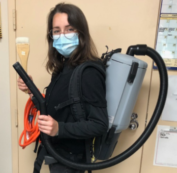 Student with Vacuum