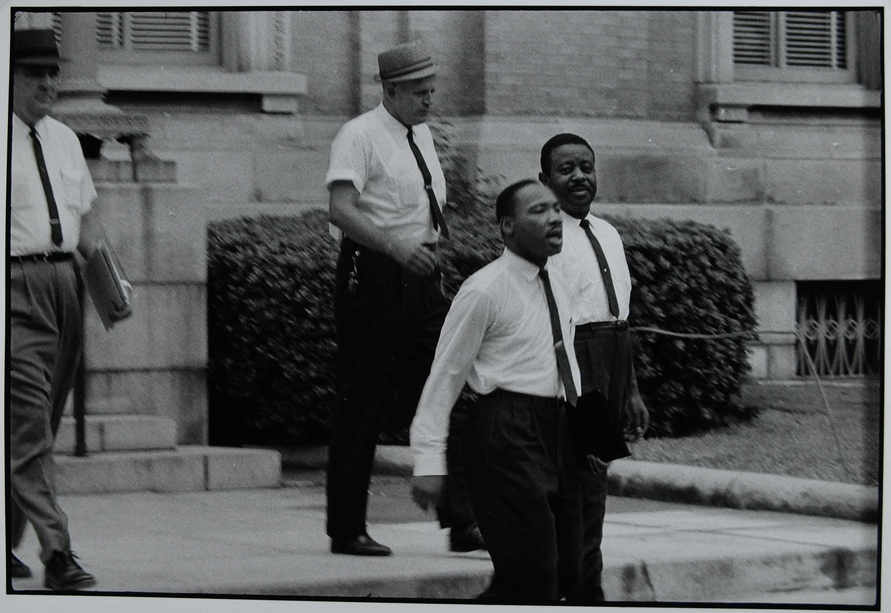 Black and white photograph of Dr. Martin Luther King, Jr. and Reverend Ralph Abernathy, 1962 by Danny Lyon