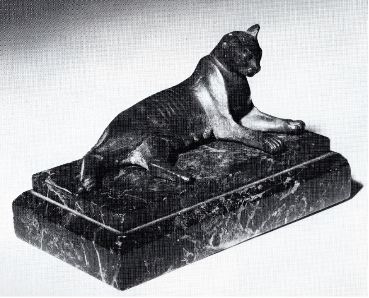 Black and white photo of a reclining cat statuette offered by Rupert Wace in Fall 2025
