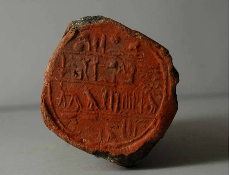 Ceramic red colored funerary cone of Userhat.