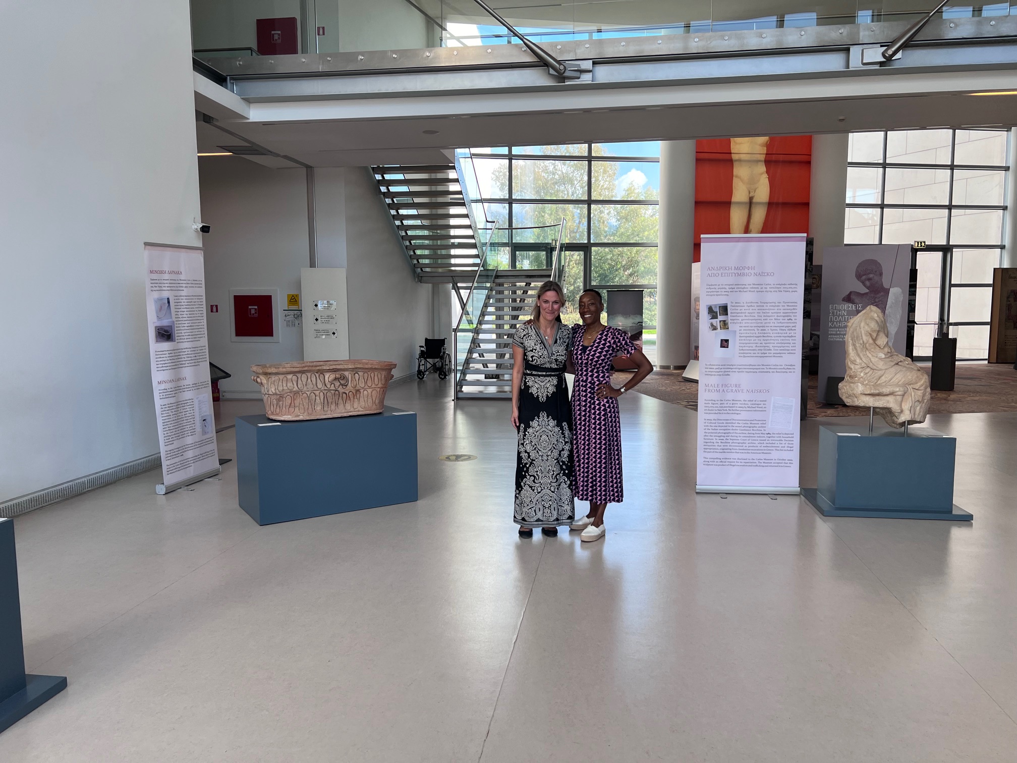 Georgia Manolopoulou of the Hellenic Ministry of Culture and Valeda Dent, Vice Provost of Emory Libraries and Museum in the exhibition at the Archaeological Museum of Patras with the returned objects. 