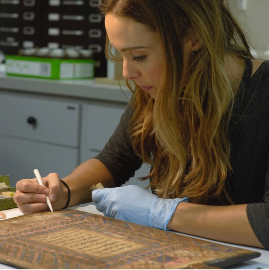 Photo of Jessica Betz Abel working in the conservation lab