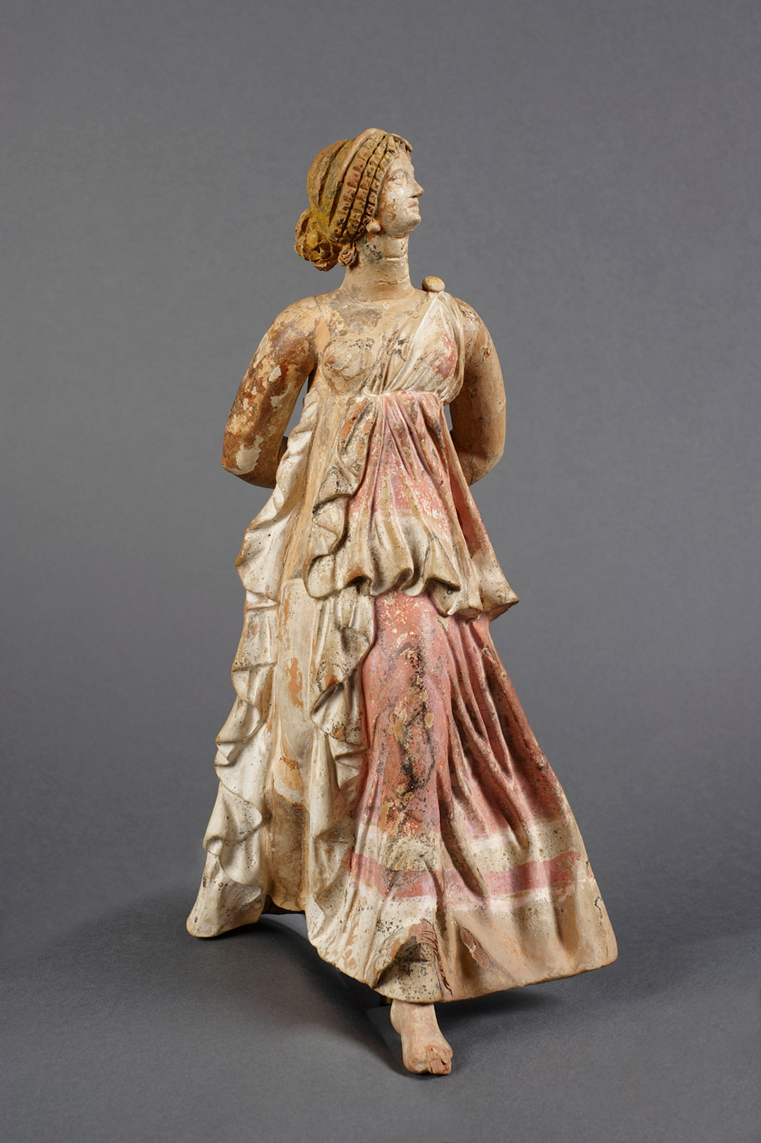 Figurine of Nike. 150-100 BCE. Ceramic, paint. Musée du Louvre, Département des Antiquités grecques, étrusques et romaines. Myr 163. 