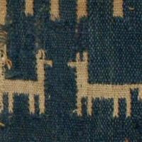 Fragment of fabric with llamas on it