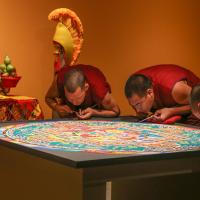 Monks create a sand mandala