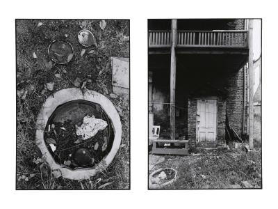 Two vertical black and white photographs by Tom Dorsey. The photo on the left is of a circular shape. When investigated further, one can identify an old sewer pipe covered with dirt and trash. The photo on the right is a close up of a white door of a two-story brick building. There is overgrown grass in the foreground.