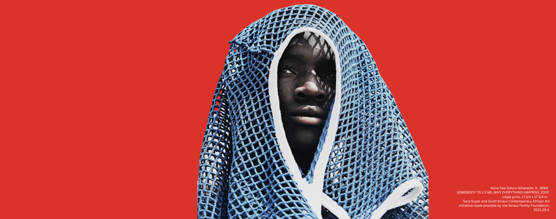 Person in front of red background