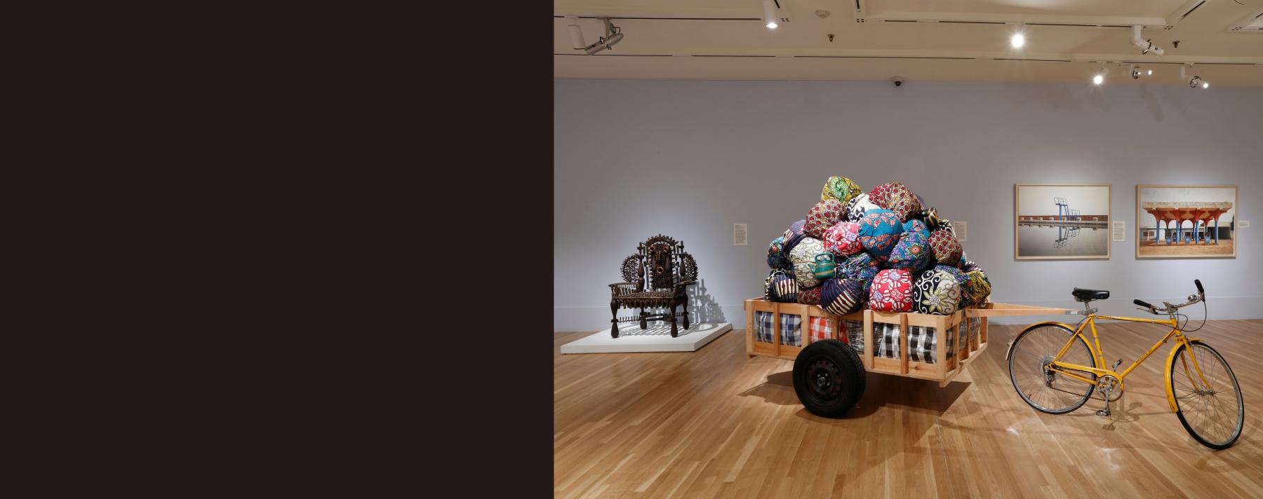 Rectangular image with black area on the left and installation view on Insistent Presence exhibition on the right