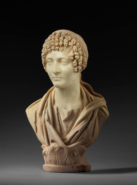 Photo of Roman Marble priestess on dark background